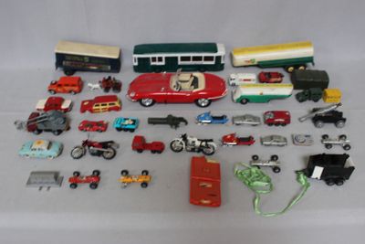 a lot of toy cars and trucks that are on a table