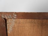 a close up of a piece of wood with writing on it