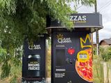 a vending machine in the middle of a field