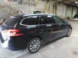 a black car that is parked in a garage