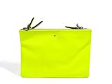 a close up of a neon yellow purse on a white background