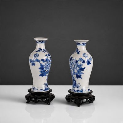 pair of chinese blue and white vases on stands