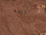 an old brown piece of cloth with a small piece of writing on it