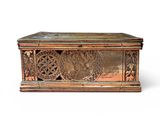 an image of a wooden box with carvings on it