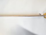 a sword that is laying on a white surface
