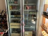 a refrigerator that has a lot of bottles in it