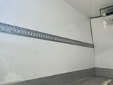 an image of a room with a wall mounted air conditioner