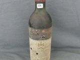a bottle of wine that is sitting on a table