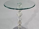 a glass table with a glass top on a white surface