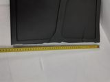 a close up of a television sitting on top of a table next to a ruler