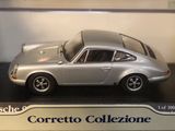 a model of a silver car on display in a box