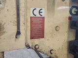a picture of a machine that is working on a piece of metal