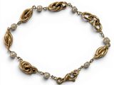 a close up of a bracelet on a white background