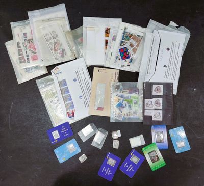 many different types of stamps and envelopes on the table