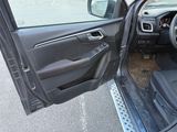 a car door open with the driver ' s seat down