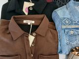 several different types of clothing are laid out on a white surface