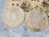 two bowls sitting next to each other on a marble table