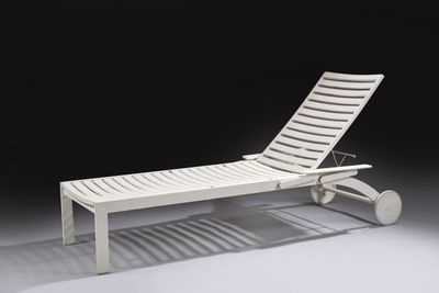 an image of a white chaise lounger with wheels on a black background