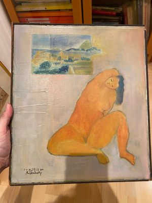 someone is holding a painting of a nude woman sitting on the floor