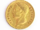l'image d'une pièce d'or sur laquelle figure une tête de femme