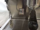 an espressor machine that is being used to make a cup of coffee