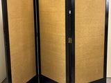 a pair of black folding screen doors with cork board panels