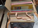 a lot of records in a bag on a table