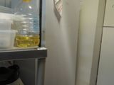 a refrigerator with a lot of bottles and containers on it