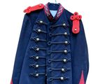 blue military jacket with red trimmings and buttons on a hanger