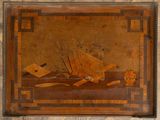 an old painting of a boat in the water on a stone wall