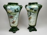 two vases that have been painted with flowers on them