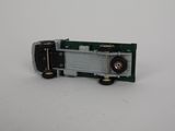 a close up of a toy truck on a white surface
