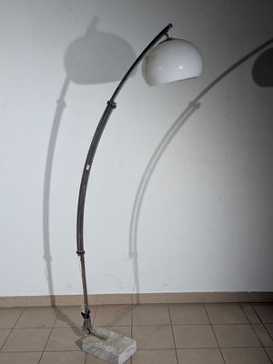 a lamp that is sitting on a stand in a room