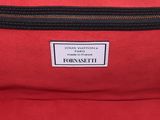 a close up of a red bag with a label on it