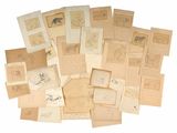 a pile of old letters and drawings on a white surface