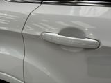 a close up of a car door handle with a sticker on it