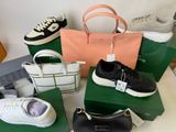 a lot of different bags and shoes on the table