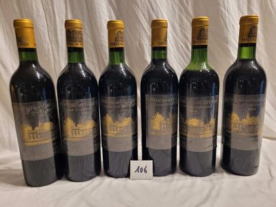 six bottles of wine are lined up on a table