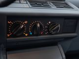 a close up of the dashboard of a car with the controls on