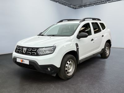 the white dacia is parked in a large white room