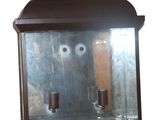 a glass display case with a cup inside of it
