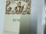 a picture of a menu with a ship on it