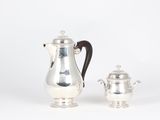 silver plated coffee pot and sugar shaker on stand