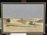 un tableau représentant une scène de désert, exposé dans un musée