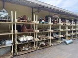 many shelves that have pots and pans on them