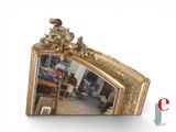 a mirror that is sitting on the wall in the room