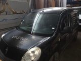 a picture of a black van parked in a garage