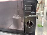 a black microwave oven with a black door and a black handle