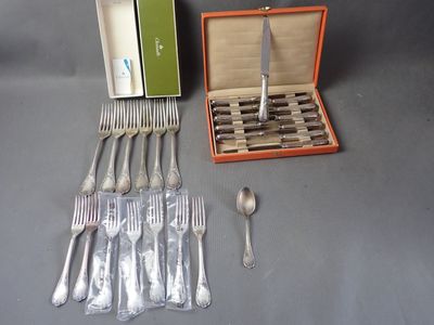 a box of silverware and a set of forks and spoons