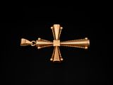 an image of a gold cross on a black background